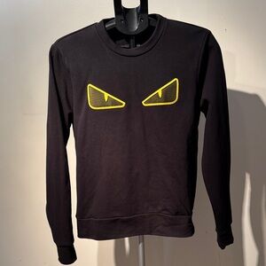 Black Sweater with Yellow Eye Design